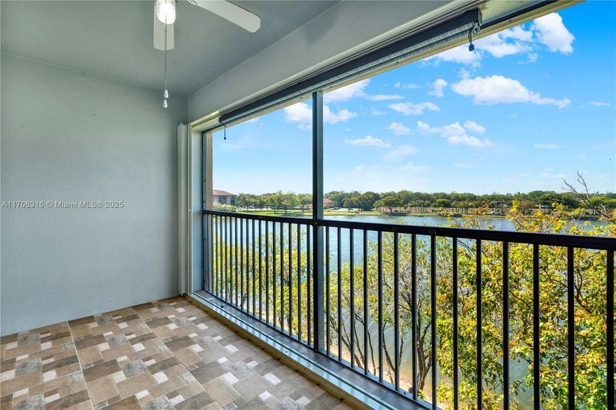 Welcome to this absolutely immaculate fourth floor unit (you will not have anyone living above you).  It has been freshly painted and brand new carpets installed.  The kitchen is substantially renovated with granite countertops. It has a nice size, screened in balcony, overlooking serene views of the lake.  The building has an elevator, community has an art theater which plays Broadway shows, a medical center, courtesy bus to bring you anywhere in the community, pools, gym, ballroom, elegant clubhouse, sauna, game room, on-site pharmacy, café, golfing and more!  Come see this property today!  55+ community Washer and dryer inside!