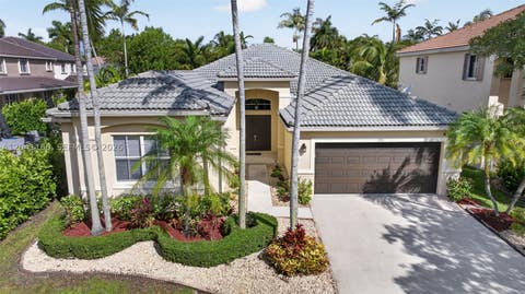 Photo of 786 Nandina Dr, Weston, FL 33327 (MLS # A12041160)