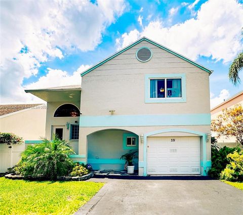 Photo of 331 NW 101st Terrace, Pembroke Pines, FL 33026 (MLS # A11845485)