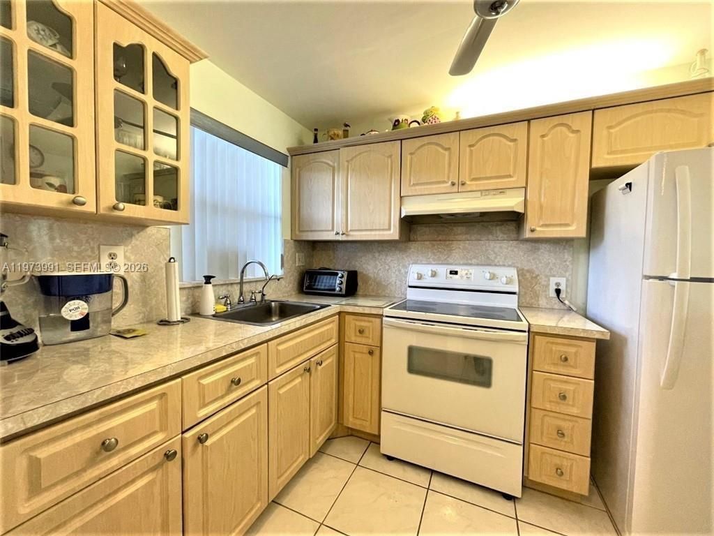 Photo of 9900 Sunrise Lakes Blvd #210, Sunrise, FL 33322 (MLS # A11973991)