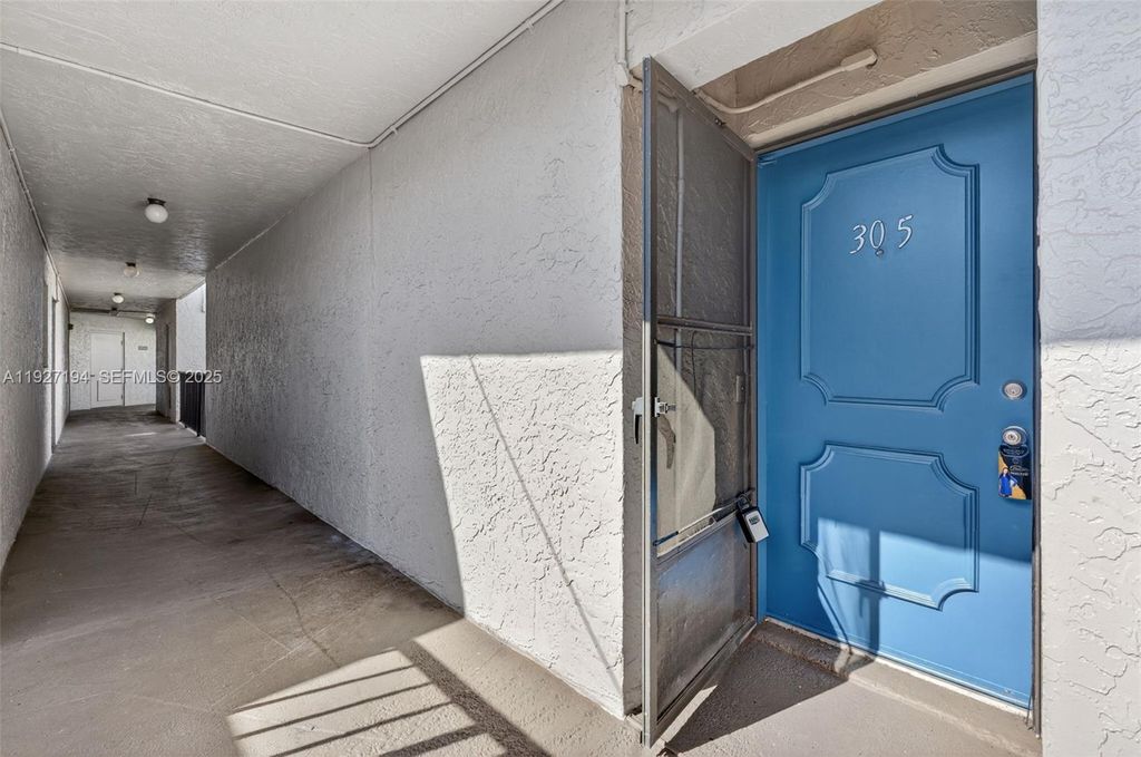 Photo of 3100 Riverside Dr #305, Coral Springs, FL 33065 (MLS # A11927194)