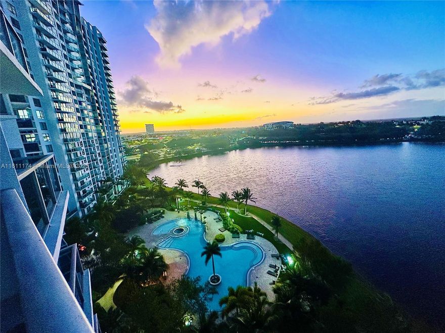 Discover luxury living in this stunning 2-bedroom, 2-bathroom apartment located in the prestigious Tao building. This unit features a European-style open kitchen with elegant wood cabinets, granite countertops, and modern stainless-steel appliances. Enjoy breathtaking lake, city, and Everglades views through impact windows, and unwind while watching the perfect sunset.
The apartment comes equipped with a convenient in-unit washer and dryer. Residents can indulge in top-notch amenities including a pool with cabanas, BBQ area, tennis court, mini golf, pool table, complete gym, and a party room. Maintenance includes internet, cable, Wi-Fi, and building insurance. Experience the best of luxury and comfort in this exquisite apartment.