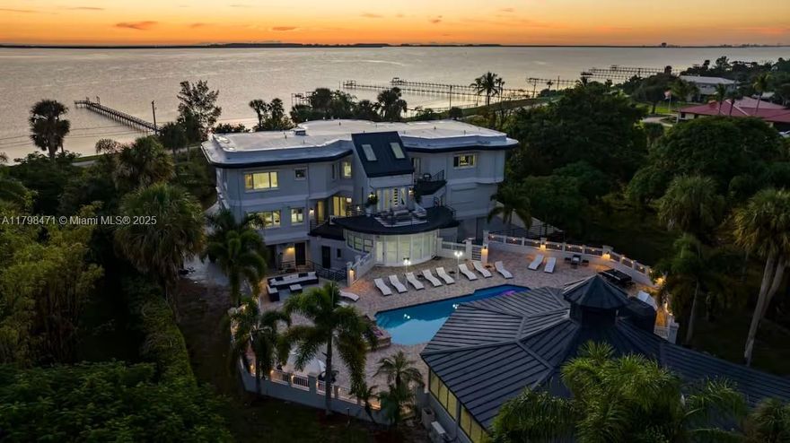 A rare gem on coveted South Indian River Drive! This breathtaking 10-bedroom, 9-bath waterfront estate boasts 100' of direct Intracoastal frontage, spectacular sunrise views, and unmatched privacy. Enjoy the beauty of Old Florida living on expansive, park-like grounds. The main home offers elegant finishes, soaring ceilings, and spacious living areas designed for comfort and luxury. A detached 2-bedroom guest house adds flexibility for extended family or guests. Entertain poolside, enjoy your private tennis court, and relax in total seclusion—this is riverfront living at its finest. No HOA. Wake up to unobstructed riverfront vistas and watch boats glide by from your backyard oasis—sunrise views here are simply unforgettable.