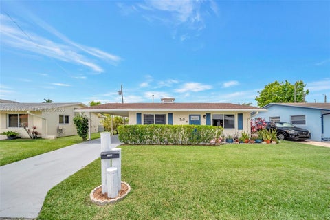Photo of 2708 NW 51st Pl, Tamarac, FL 33309 (MLS # A12033002)