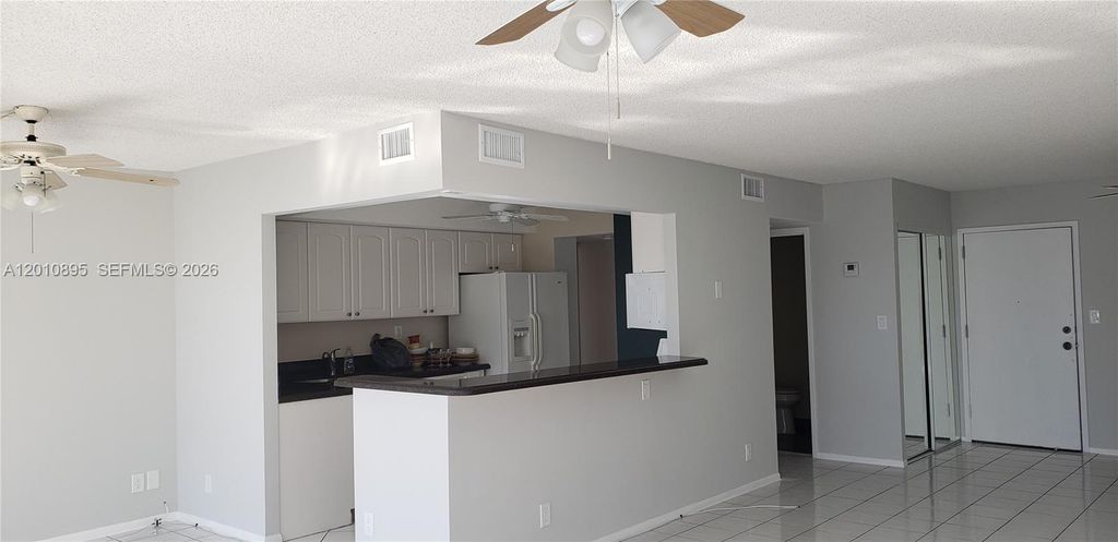 Photo of 851 Three Islands Blvd #502, Hallandale Beach, FL 33009 (MLS # A12010895)