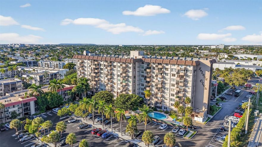 Seller offering $5K towards Buyer's Closing Costs! Beautiful 2 Bedroom/1.5 Bath overlooking a the pool and minutes to Pompano Beach & Pier. UPDATED KITCHEN with granite counters. 2nd bedroom currently used as an office/dining area. Can be converted back to a bedroom. Custom Built-ins for home office. SPACIOUS PRIMARY BEDROOM with Large Walk-in Closet. GORGEOUS UPDATED PRIMARY BATH. Newer laminate flooring in Kitchen & Primary Bedroom. Impact Windows & Accordion Shutters on ALL Windows. Maintenance Fee includes Basic Cable TV, Water, & Trash. Community offers 24-hour manned gate for security, fitness center, private building swimming pool, sauna, putting green, Billiards room, Library, BBQ area, and much more! One Reserved Parking space. 40 YEAR Inspection completed; all assessments paid by the Seller. Leasing Permitted after 2 years. Storage Locker. Laundry Room on each floor. Plenty of Guest Parking. HWH 2016, HVAC 2018 Electrical Panel 2017.  Come & live the the Florida Lifestyle!