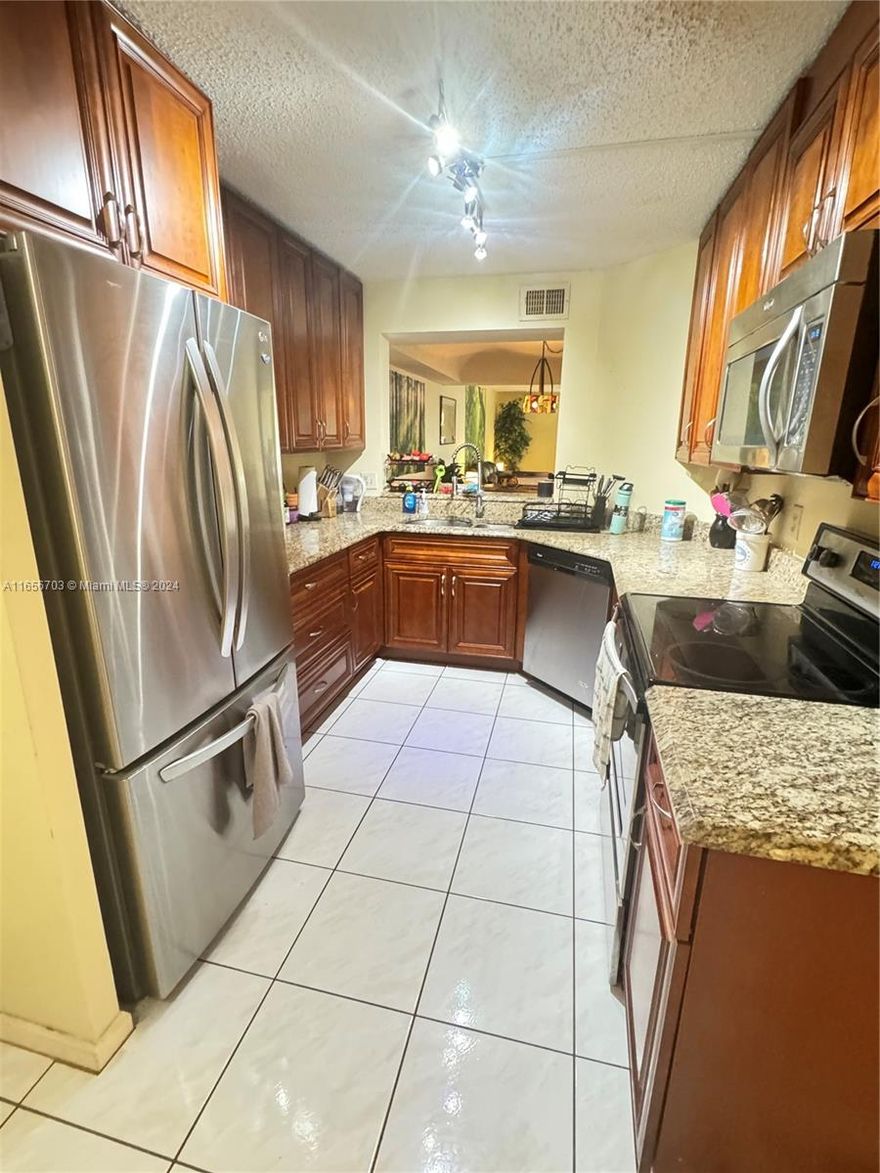 ABSOLUTELY GORGEOUS, 2 BED, 2 BATH SPACIOUS SPLIT FLOOR PLAN, CONDO HAS BEEN UPDATED, CERAMIC AND WOOD FLOORING, HARDWOOD KITCHEN WITH GRANITE COUNTER TOPS AND STAINLESS APPLIANCES, MASTER BEDROOM HAS LARGE WALK- IN CLOSET. WASHER DRYER IN THE UNIT, SCREENED SPACIOUS BALCONY OVERLOOKS POOL AND GARDEN. BAR IN DINING ROOM. COVERED ASSIGNED PARKING. ELEVATOR IN THE BUILDING. GREAT COMMUNITY WITH POOL NEXT TO THE BUILDING, TENNIS COURTS, MINT CONDITION. CLOSE TO SHOPPING AND RESTAURANTS , DON'T MISS THIS ONE. ADULT COMMUNITY/ONE PERSON MUST BE 55+ TO LIVE IN THIS CONDO. HURRICANE SHUTTERS.