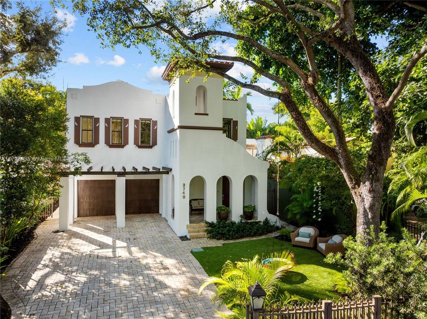 Exquisite, custom-built home on a coveted, tree-canopied (no thru-traffic) street with it’s own private park. The foyer entry opens to light-filled living spaces w/20’ ceilings & exceptional fixtures & finishes throughout: Amazonian Rosewood flooring, extensive custom millwork & built-in cabinetry, Crema Marfil marble, Fine Art chandeliers & sconces and Toto plumbing fixtures. Stunning kitchen features 2 cooking islands and Sub-Zero/ Wolf appliances. Incredible primary suite has it’s own private foyer, 16’ ceilings, a room sized walk-in closet/dressing room & luxurious bath. Lush, tropical garden w/ towering oaks surround the home and create an ultra-private retreat w/ deep terrace overlooking a large in-ground spa. Close to the historic Grove village, top-tier schools & bayfront parks.