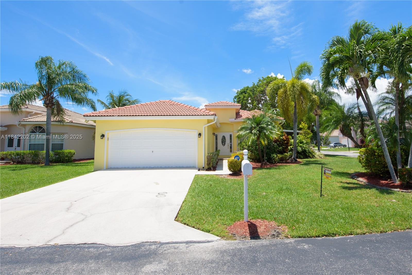 Spacious 3BR/2BA corner home in desirable Keys Gate! This larger unit features a welcoming foyer, bay window in the living room, separate dining area, and a bright family room w/ sliding door. Kitchen offers white cabinets, pantry & glass door leading to a large, screened patio with ceiling fan. Great for relaxing or entertaining. Bedrooms have wall-to-wall closets; primary suite includes a walk-in closet & tray ceiling. Primary bath has double sinks, extended counter, shower, private toilet room & linen closet. Guest bath w/ tub/shower. Laundry room with washer, dryer, hot water heater, and shelves. 2-car garage w/ automatic doors. Laminate floors, ceiling fans & accordion shutters throughout.