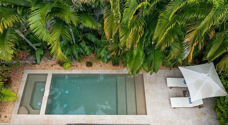 A rare jewel in Miami, this sun-drenched home delivers a true resort-style lifestyle with a completely reimagined backyard featuring a heated saltwater pool, separate spa, lush palms, and dramatic night lighting—designed for effortless indoor-outdoor living year-round.
•  Completely redesigned backyard (2023) with luxury finishes/French drains
•  100% impact windows + impact front door & patio slider
•  Heated saltwater pool + separate spa
•  Custom aggregate pool finish with Moroccan tile accents
•  Lush palm landscaping with designer night lighting
•  Pergola, summer kitchen, and covered porch for entertaining
•  Naturally high elevation (no flood zone) with drainage system
•  Upgraded electrical panel with surge protection
•  Higher ceilings than typical for this era
•  Remodeled interior with modern finishes
•  Roof (2015) /Zen Garden
•  Improved plumbing
•  Reverse-osmosis water filtration in kitchen
•  Fully automated pool & spa system
•  Resealed driveway
•  Sleek linear slot diffuser A/C vents
•  Impeccably maintained and truly turnkey