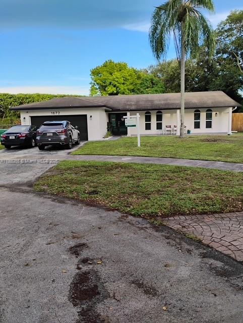 Welcome to this captivating single-story modern home in sought-after Miami Gardens’ Rolling Oaks Estates! This beautifully transformed residence offers approximately 2,877?sq?ft of gracious living. Step inside to discover brand-new flooring underfoot, a recently replaced roof, upgraded A/C, and impact-resistant windows throughout—ensuring comfort, efficiency, and peace of mind. The open, light-filled layout is perfect for seamless everyday living and entertaining. Set on a generous, nearly 0.6-acre lot, this home combines remarkable curb appeal with ample outdoor space for gatherings, gardening, or future enhancements. Excellent location near top schools, shopping, and major thoroughfares. Don’t miss your opportunity to own this stylish, turnkey gem!"