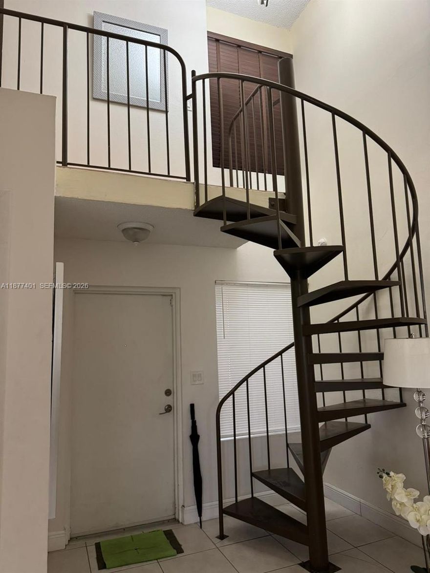 Two story condo in a gated community. the unit features a master bedroom on the second floor with a large walk-in closet and a full bathroom. On the main floor, there is a second bedroom with a full bathroom. The condo also includes an updated kitchen and an in-unit washer and dryer. The community offers a pool and playground area for residents.