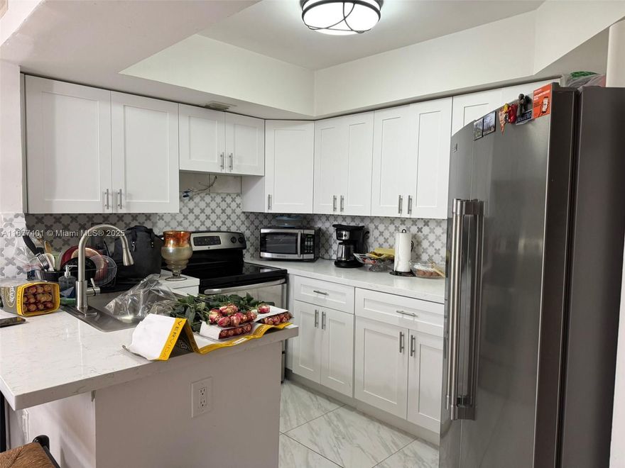 Two story condo in a gated community. the unit features a master bedroom on the second floor with a large walk-in closet and a full bathroom. On the main floor, there is a second bedroom with a full bathroom. The condo also includes an updated kitchen and an in-unit washer and dryer. The community offers a pool and playground area for residents.