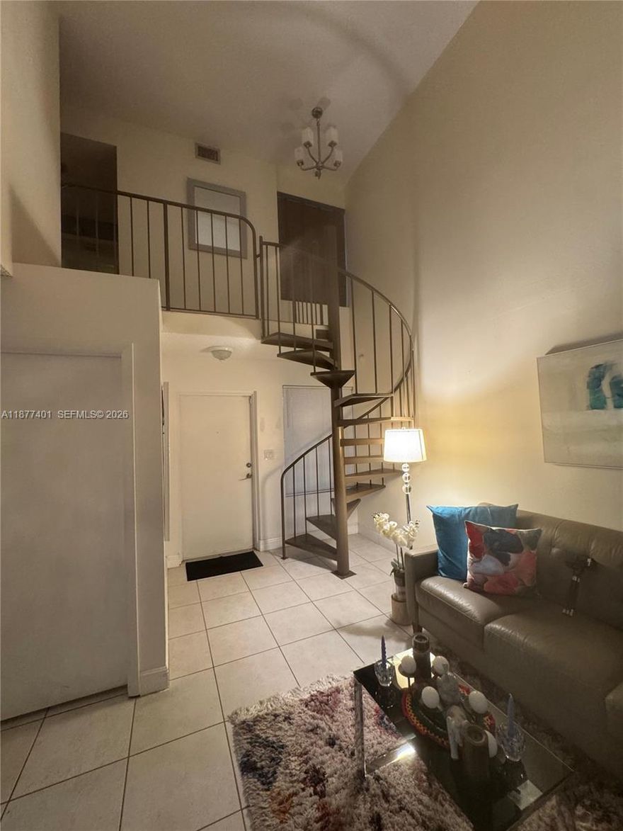 Two story condo in a gated community. the unit features a master bedroom on the second floor with a large walk-in closet and a full bathroom. On the main floor, there is a second bedroom with a full bathroom. The condo also includes an updated kitchen and an in-unit washer and dryer. The community offers a pool and playground area for residents.