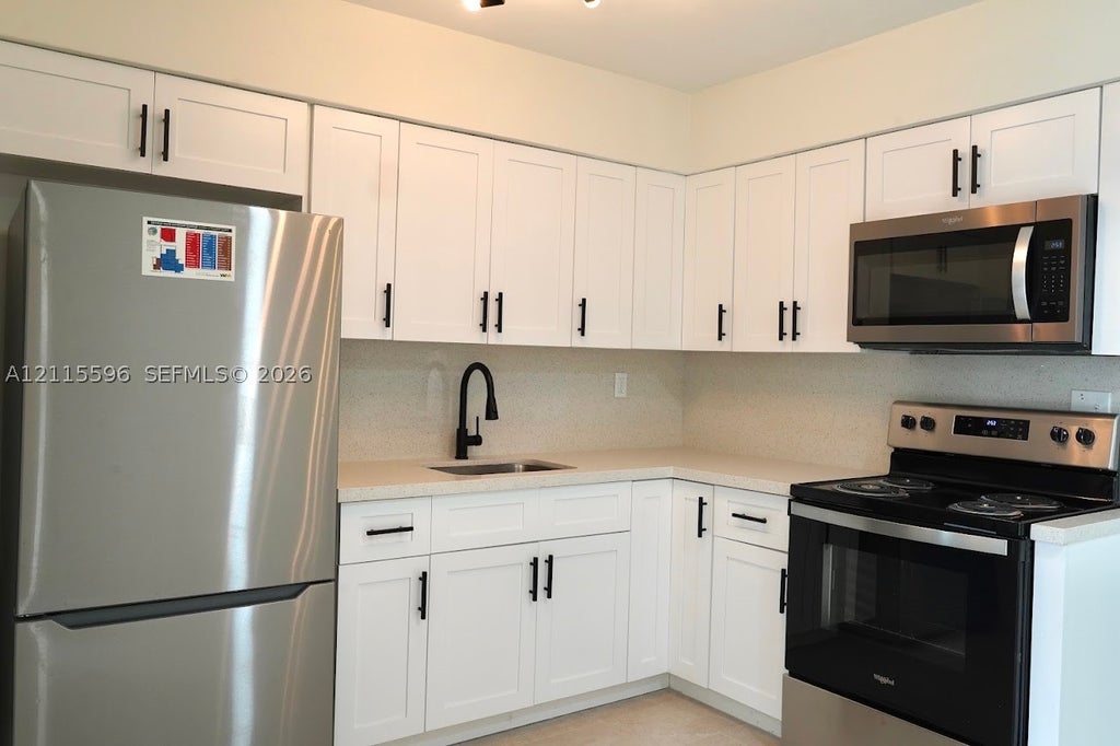 Photo of 1411 NW 58th Ave #1411, Lauderhill, FL 33313 (MLS # A12115596)