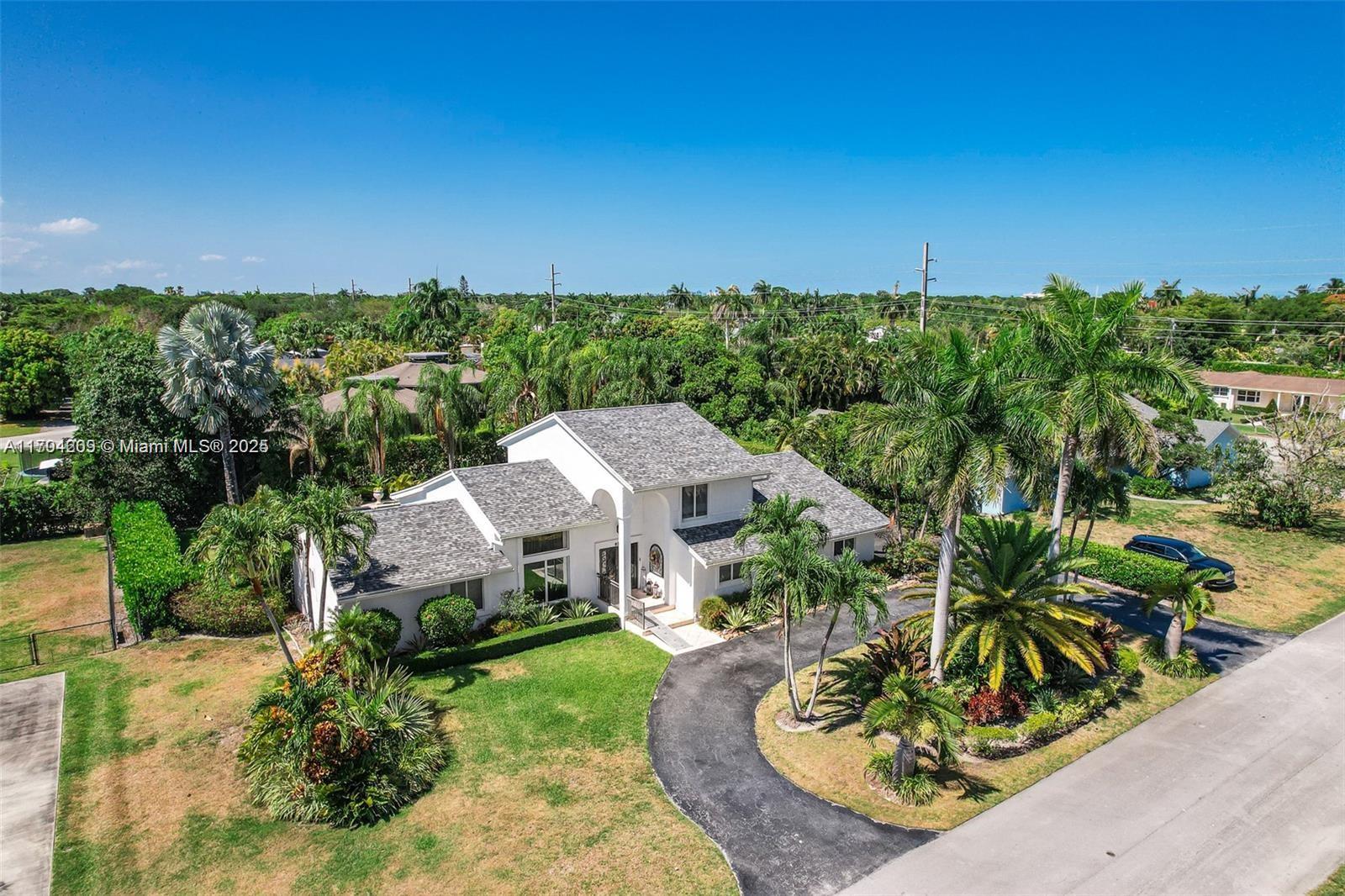 Welcome to this spacious and beautifully maintained 6 bedroom + den . This home boasts a thoughtfully designed layout with abundant natural light and ample living space for family and guests. There's an area that can be used as in-laws quarters.The heart of the home is a 2021 modern kitchen w/quartz countertops, island ,porcelain sink,high end cabinets & brass embedded decorative tile backsplash that seamlessly connects the family room and dining area.Master bedroom is and 3 bedrooms are downstairs, upstairs you will find 2 bedrooms and a double sink bath. Step outside to your private oasis - a luscious backyard with mature landscaping, perfect for entertaining or unwinding. Enjoy the sparkling pool and spa ideal for relaxation on warm Florida days. Space for RV & Boat 2018 Roof & NO HOA!