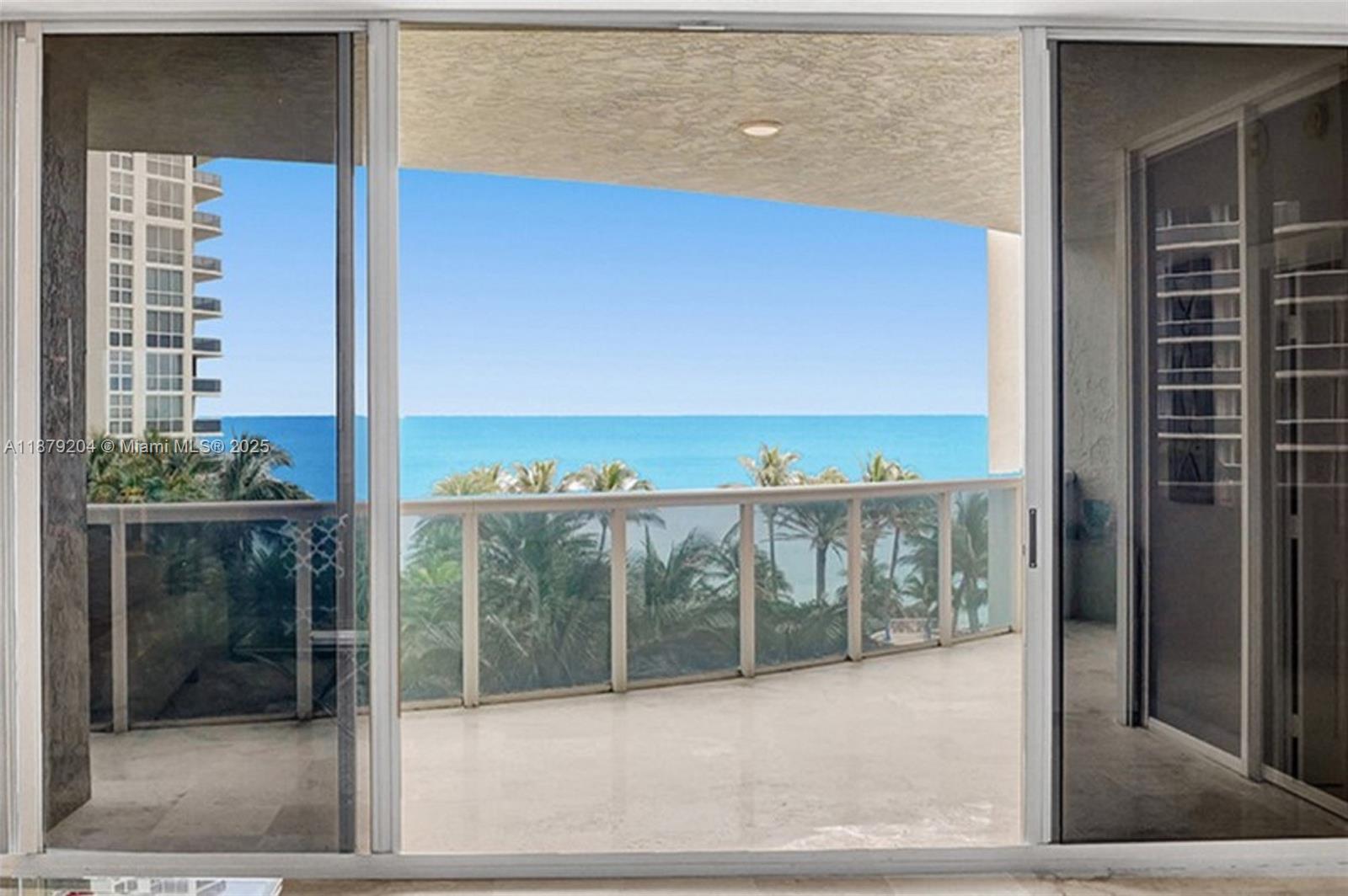 Spectacular ocean and city views! This gorgeous floor through 3 bedroom 2.5 bedroom residence has it all. Floor to ceiling IMPACT glass doors, open floorplan with ocean views, brand new white porcelain floors throughout, beautiful all white kitchen, marble flooring throughout, new powder room, big laundry room with storage, private foyer entry and more. 2 expansive balconies, one with ocean views and the other with city views. 2 garage parking spaces! Additional storage. Endless resort style amenities include pool, fitness center, tennis courts, cafe and valet. 2 dogs allowed. Association has strong reserves, Recent structural and integrity studies completed.
