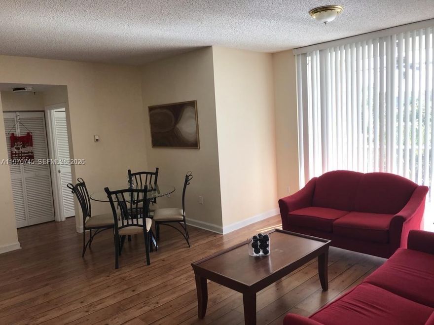 Beautiful 2-bedroom, 2-bath condo located in desirable Doral House. This well-maintained unit features modern laminate flooring throughout and a comfortable, functional layout perfect for living or investing. Enjoy access to an exclusive club membership offering fantastic amenities including pickleball courts, tennis courts, a swimming pool, golf course and more. Centrally located near shopping centers, malls, parks, and minutes from City Place Doral and top-rated A+ schools. This community offers 24-hour security and is well maintained. Don't miss this opportunity.