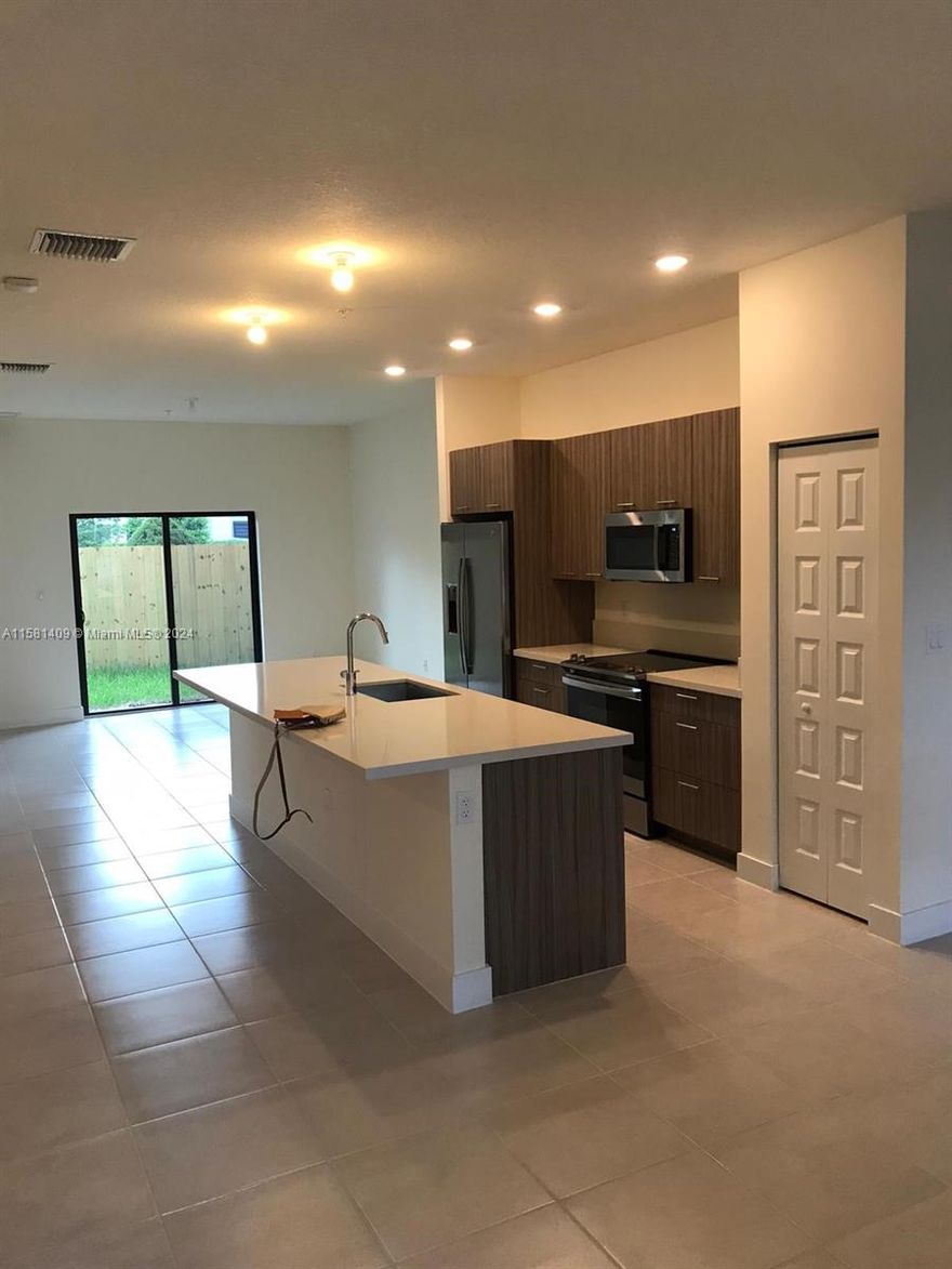 Welcome to your dream apartment in Doral! This spacious 2-bedroom, 2-bathroom residence with a den is perfect for a home office or guest room. Located on the first floor, it offers direct access to your own backyard—ideal for weekend barbeques. The kitchen is a chef's dream with sleek stainless steel appliances, blending style and functionality.

Located in the heart of Doral, you're steps away from world-class amenities. Stay active with a top-notch gym, the largest pool in Doral, tennis courts, and much more. The neighborhood is surrounded by A+ schools, shopping centers, grocery stores, restaurants and quick access to major highways. It's everything you need for a comfortable and convenient Miami lifestyle. Don't miss your chance to call this incredible apartment home!