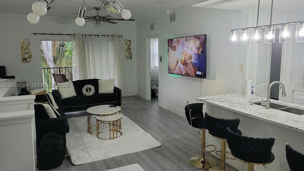 Photo of 5840 W Sample Rd #302, Coral Springs, FL 33067 (MLS # A12069094)