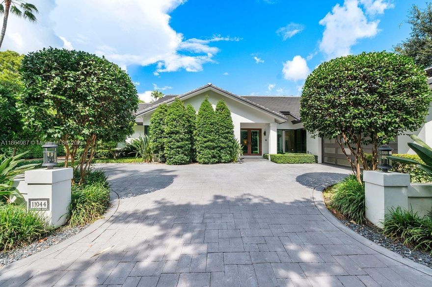 Privacy is the ultimate luxury. Enter Arabesque, a walled community of only 18 homes in Pinecrest, developed in 1990 by one of south Florida’s renowned builders. This 3,254 SF, 4 bed/3 bath corner home was elegantly updated in 2019 to the most discerning standards. Plenty of natural light flows through impact windows and doors. The split floor plan offers a tranquil primary suite with his/hers closets, access to outdoor living area, and views of the pool and garden on one side, and three large bedrooms and two baths on the other. The main living area, with updated kitchen, breakfast space, and family room, open to a large covered patio and pool. Formal living and dining rooms flank the front entrance. The true two-car garage has plenty of built-in storage and epoxy floor. Perfect location.