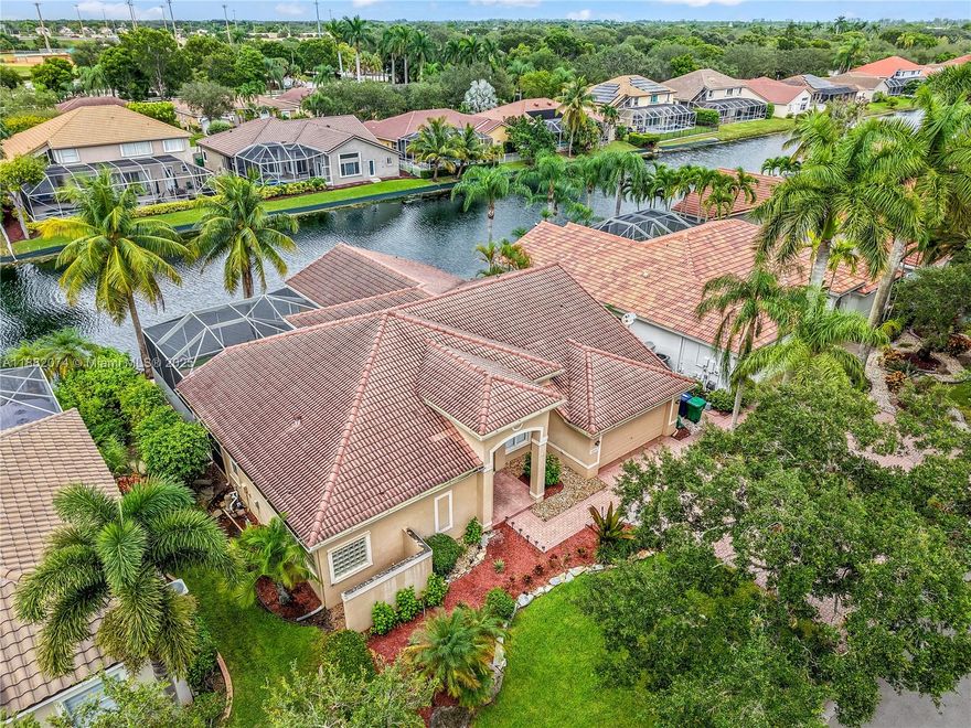 Elegant spacious pool home with wide water view features 4 bedrooms and 3 full bathrooms. Ones you enter you are greeted by the 12' volume ceiling. Upgraded kitchen with exotic granite counter top and 42" high cabinetry, waterfall sides kitchen island, SS appls. Spacious principal bedroom has large customize walk-in closet, upgraded bathrooms with roman tub and shower. Pool has LED multicolor lighting brining fun when gets dark. Across from North Community park. Excellent location and schools. Close to restaurants, parks, shopping and highways.Drive to the beach in less than 30 mins