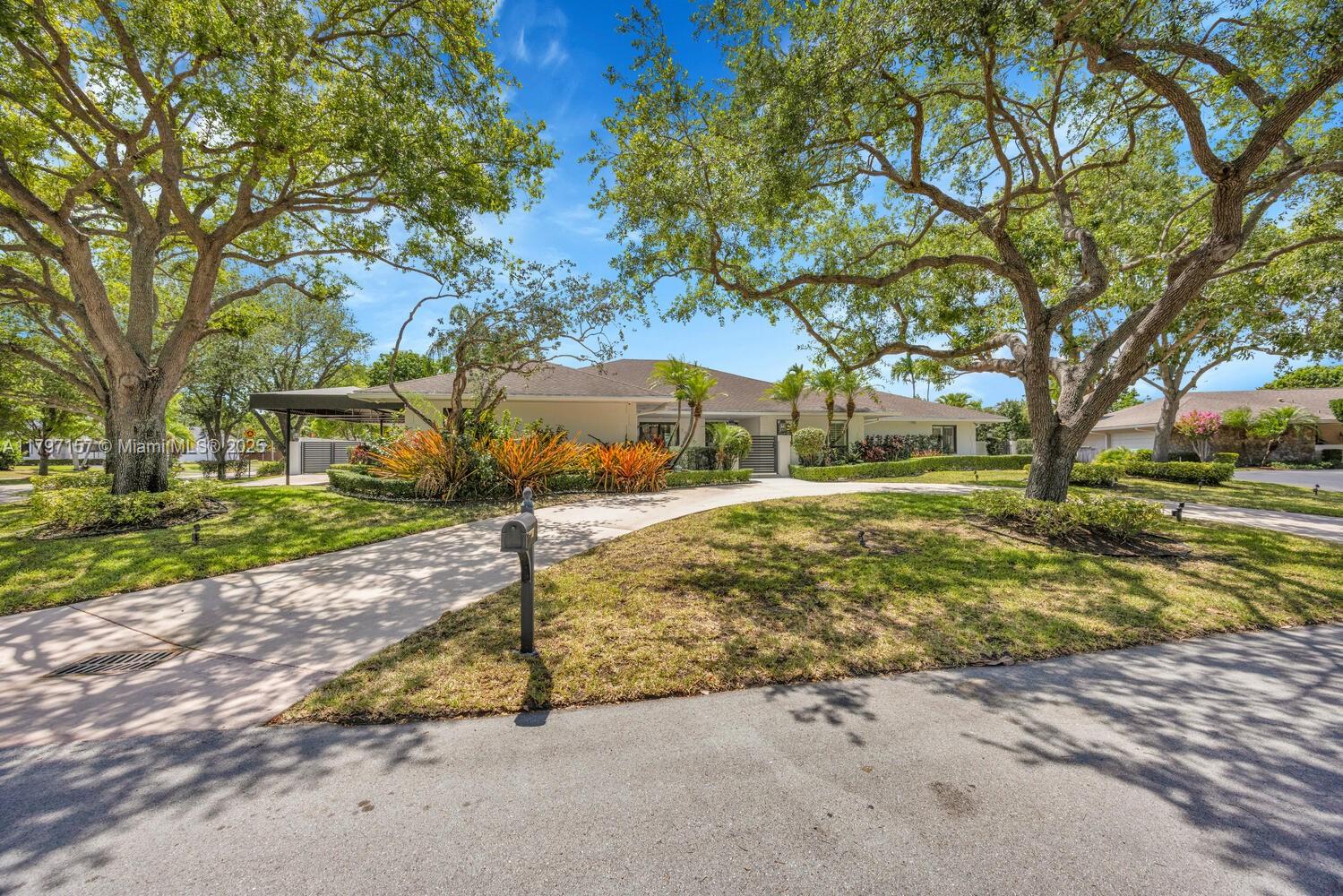 Picture-perfect Palmetto Bay home on a quiet cul-de-sac in “NO FLOOD ZONE!” (hard to find!) Over 4,550 square feet under roof, this beauty features a 2018 roof, impact windows/doors, full-house generator, split-bedroom layout, and indoor laundry room. The white kitchen with vaulted tongue & groove ceiling overlooks a saltwater pool, screened patio, summer kitchen, and covered seating—great for entertaining. Enjoy marble-like tile, Plantation shutters, spacious primary suite with luxe bath and walk-in closet, and custom millwork throughout. KitchenAid fridge (2023), new water heater, new awning carport, two concrete driveways with lots of parking, lush landscaping with mature oaks, privacy wall, and tons of natural light!