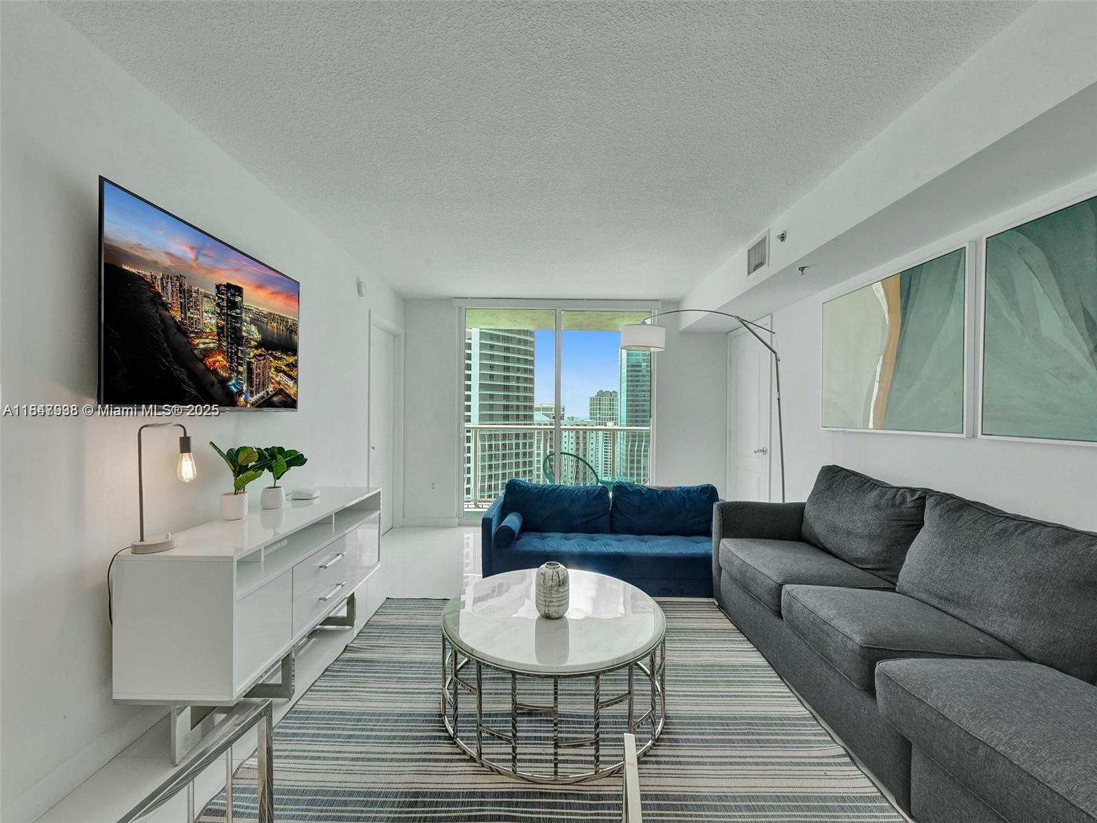 Motivated Seller - Newley remodeled 2 bed 2 bath with Water view. AirBB allowed NO WAITING. The building is setup for short-term rental - 2 Pools - 1 heated, 1 saltwater, Jacuzzi, sauna, Gym, game room, 24 hour maned front desk, 6 elevators and much more. Located in the heart of Brickell, minutes from airport etc.