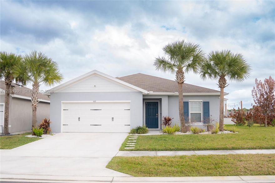 Beautiful 4-bedroom, 2-bath home in Avalon Crossing on an oversized lot. Features include custom closets in every bedroom, custom wood pantry and laundry closet, updated kitchen and baths, stainless steel appliances and smart home upgrades. Automatic blinds, zebra blinds, curtain rods, and blackout curtains. Garage includes epoxy floors and AC, great for a workspace, home gym, or lounge area.
Backyard features a large patio, fire-pit area, market lighting, and marble and river rock landscaping. Private irrigation well significantly reduces water costs.
Conveniently located near I-95, Florida’s Turnpike, shopping, dining, Tradition, and local beaches.