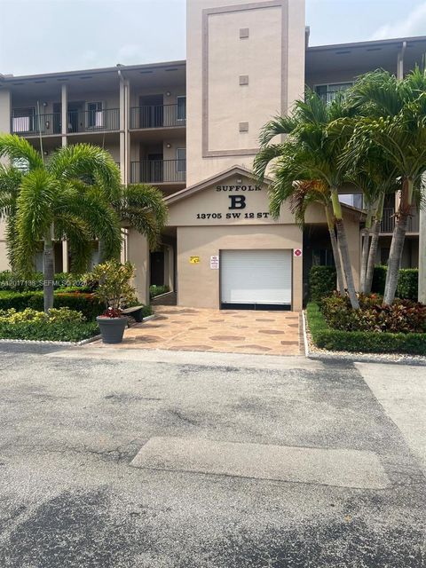 Photo of 13705 SW 12th St #208B, Pembroke Pines, FL 33027 (MLS # A12017138)