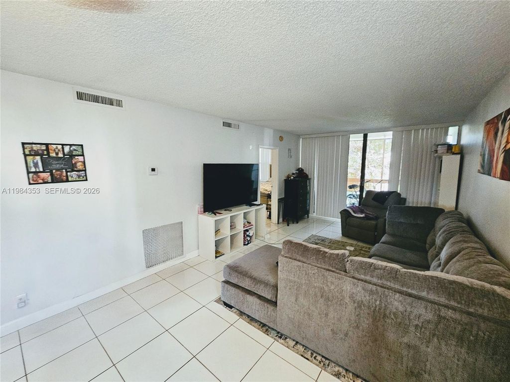 Photo of 8429 Forest Hills Dr #305, Coral Springs, FL 33065 (MLS # A11984353)
