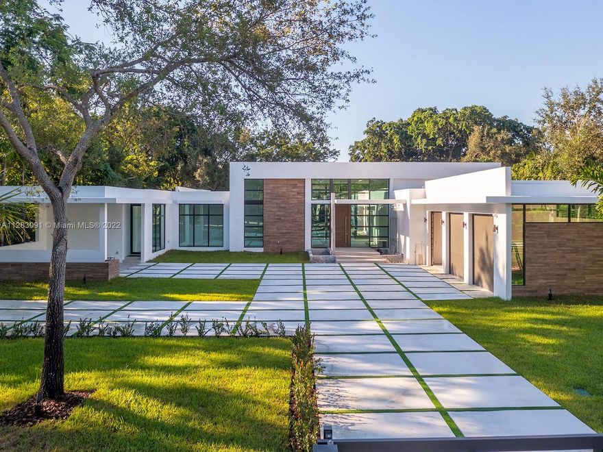 State-of-the-art 2022 Brand-new Modern estate in Pinecrest built w/the finest finishes and details. This stunning home welcomes you with a one-of-a-kind open floor plan offering volume ceilings, panoramic views of the serene outdoors. Discover expansive living areas including an Italian-style chefs eat-in kitchen with Wolf/SubZero appl, butler’s pantry and wine gallery. Lavish master suite offers walk-in closets, spa bath w/ floating tub and rain shower. Find a spectacular backyard oasis featuring huge pool w/tanning ledge, jacuzzi, covered terraces, custom built-in summer kitchen and huge yard. Additional features: guest/in-law suite, maids rm, laundry rm, & 3 car garage.