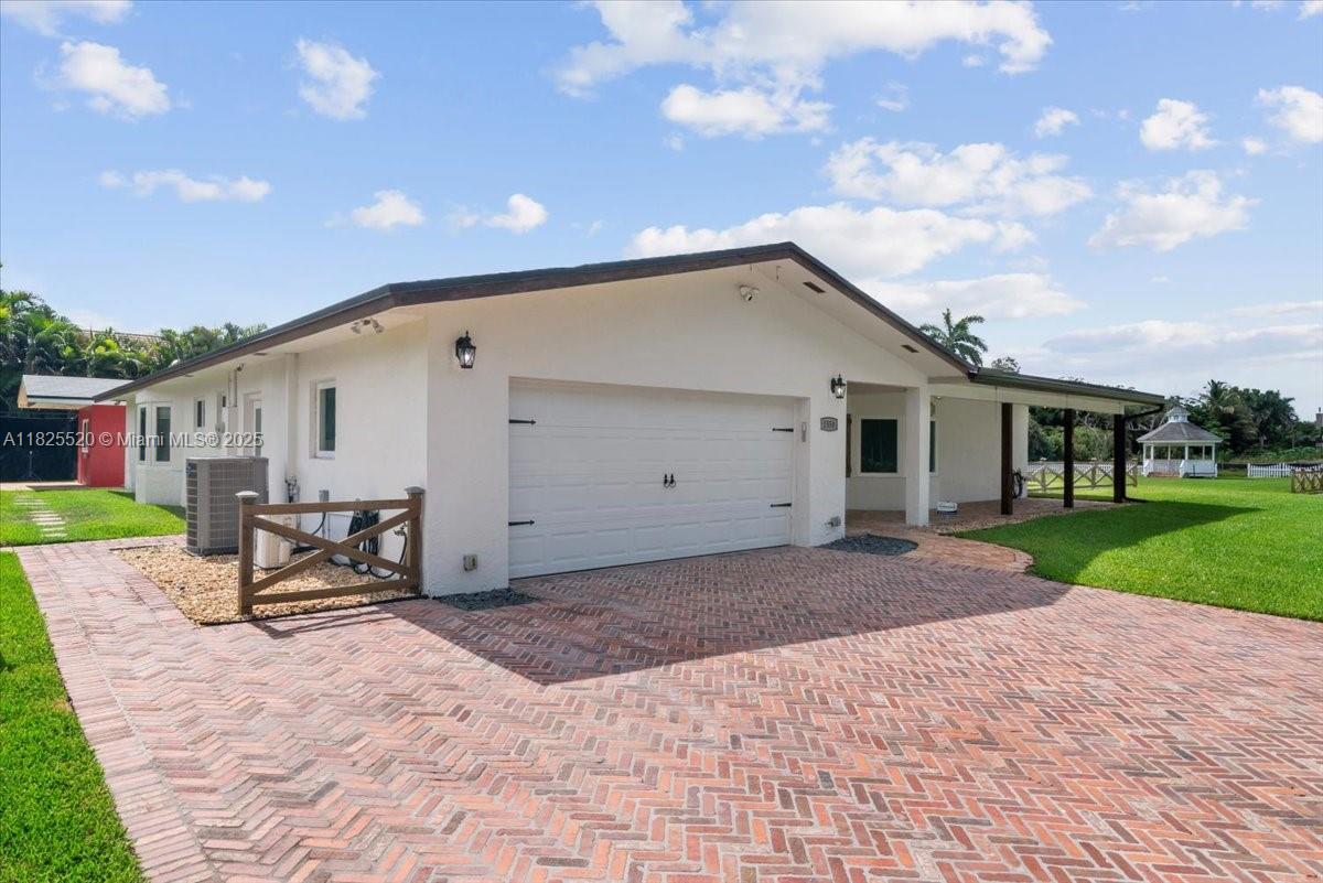 ***Tropical Paradise in Plantation Acres! This stunning 4BD/3BA home offers a gourmet kitchen w/quartz countertops, SS appliances & butler’s pantry. Formal living room w/wood-burning fireplace, family room & updated baths. Bamboo & tile floors, crown molding throughout. Impact-resistant doors & windows, plus multiple bay windows filling the home with natural light. Master suite features a spacious custom closet. Nestled on a quiet cul-de-sac, enjoy peaceful bird songs daily. Private resort-style backyard w/pool, coral stone deck, lush gardens, fire pit, powered pool house, gazebo & storage sheds. Your Florida dream home!***