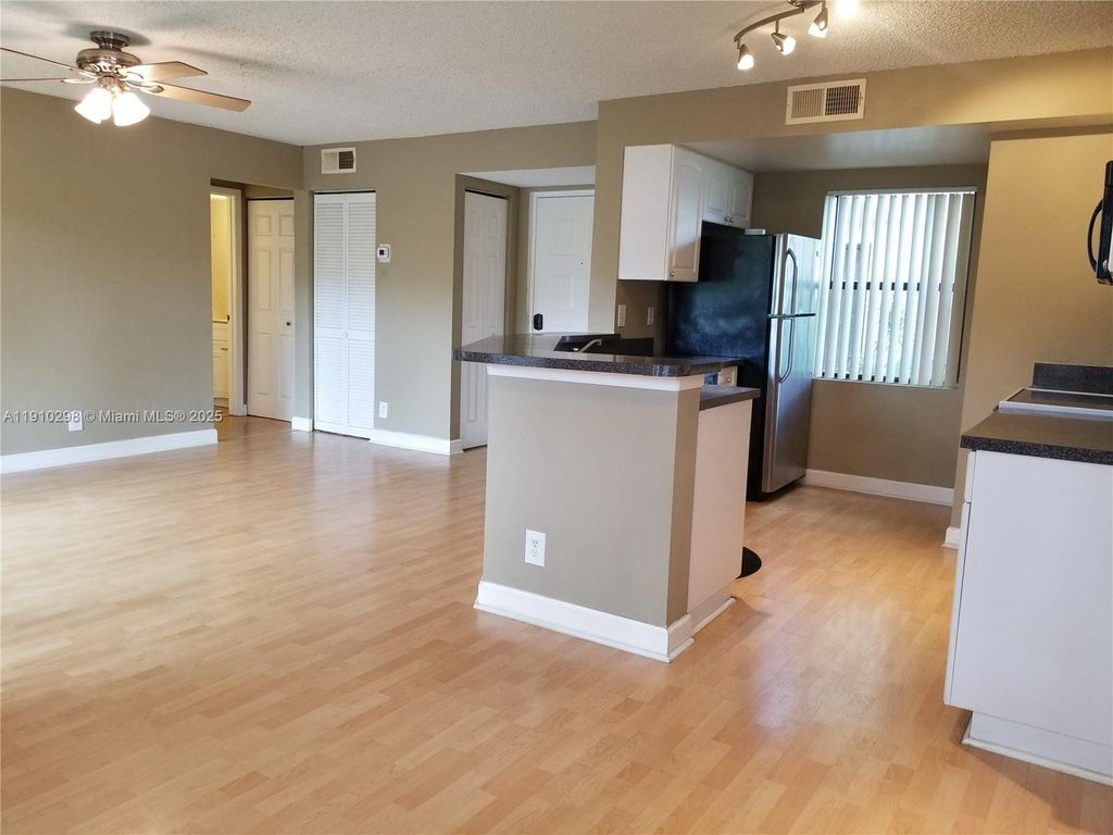 Photo of 9999 Summerbreeze Dr #501, Sunrise, FL 33322 (MLS # A11910298)
