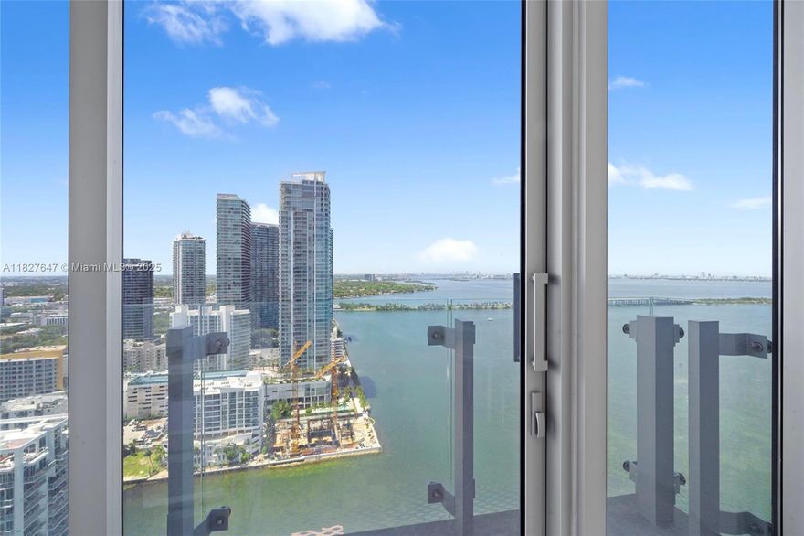 Highest-floor 01-line available—prime corner unit with floor-to-ceiling glass and stunning water views from every bedroom. This 3 bed + den (convertible 4th) & 4.5 bath residence spans 2,368 SF interior + 188 SF terrace with unobstructed bay, ocean & skyline views. Features include private elevator entry, 10-ft ceilings, marble floors, upgraded lighting, electric window shades, and abundant closet space. Chef’s kitchen with Sub-Zero, Wolf appliances, wine cooler & Italkraft cabinetry. Serene and quiet balcony setting with no street noise—ideal for relaxing or entertaining. Best price per SF in any branded new construction with direct waterfront views. Amenities include Olympic & lounge pools, bayview gym, yoga studio, spa, sauna, tennis, salon, screening room, kids’ club, pet spa & more.