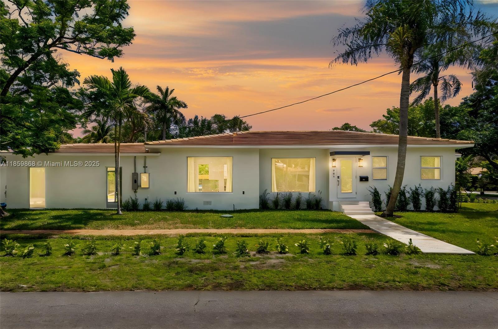 Experience luxury living in the prestigious Biscayne Park neighborhood. This fully remodeled residence has been meticulously designed to offer comfort and style in every detail. Nestled on a generous 10,350 sqft lot with stunning mature trees, the home provides a serene and picturesque setting. Additional features include a private driveway for up to 4 vehicles, an automatic irrigation system, and elegant landscape lighting throughout the garden.