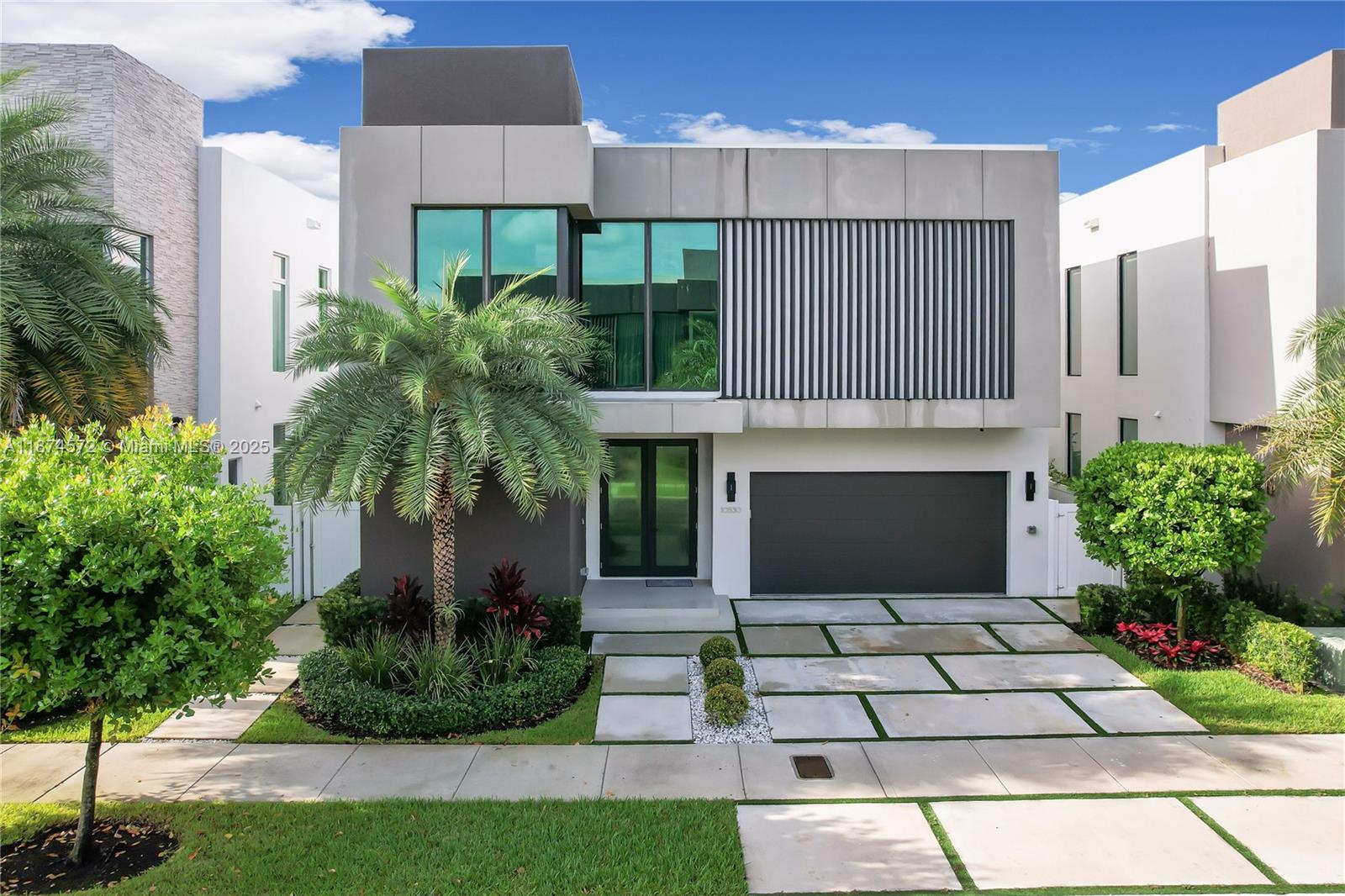 PRICED TO SELL!! THIS HOME IS A ONE OF A KIND, IT'S A MUST SEE!!! This incredible Mansion is part of the newest collection "Hybrid" of certified green homes that combine luxury and sustainability; built with the latest eco-friendly materials, these homes create a new lifestyle experience. Two-story, 4,138 SF, 5 Bedrooms, 5.5 Bathrooms, w/ sophisticated finishes & upgrades: double-height ceilings in living area, glass staircase, outdoor living area with summer kitchen and pool with a waterfall feature. Custom Italian kitchen w/ SubZero/Wolf appliances, walk-in closets, high-impact windows, complete house water filtration system, security cameras & alarm, large garage. Exclusive gated Community also includes a state-of-the-art gym and kids' play area. Home can be sold furnished.