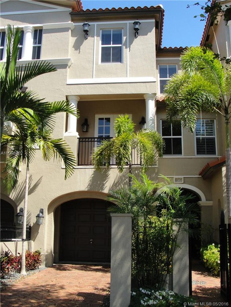 EXCEPTIONAL TOWNHOME!. TRILEVEL WITH ELEVATOR. ONE BEDROOM DOWNSTAIRS, GREAT ROOM UPSTAIRS, INFORMAL DINING AREA. BEAUTIFUL KITCHEN, GRANITE COUNTERS, SS APPL, 3 BEDROOMS IN TOP FLOOR W/ 2 BALCONIES. CROWN MOLDINGS, MARBLE & WOOD FLOORS, HIGH CEILINGS, FRENCH DOORS & HURRICANE IMPACT WINDOWS THROUGHOUT, 1 CAR GARAGE. ENJOY YOUR BBQ IN YOUR PRIVATE PATIO. LOCATION & LUXURY AT AN AFFORDABLE PRICE.