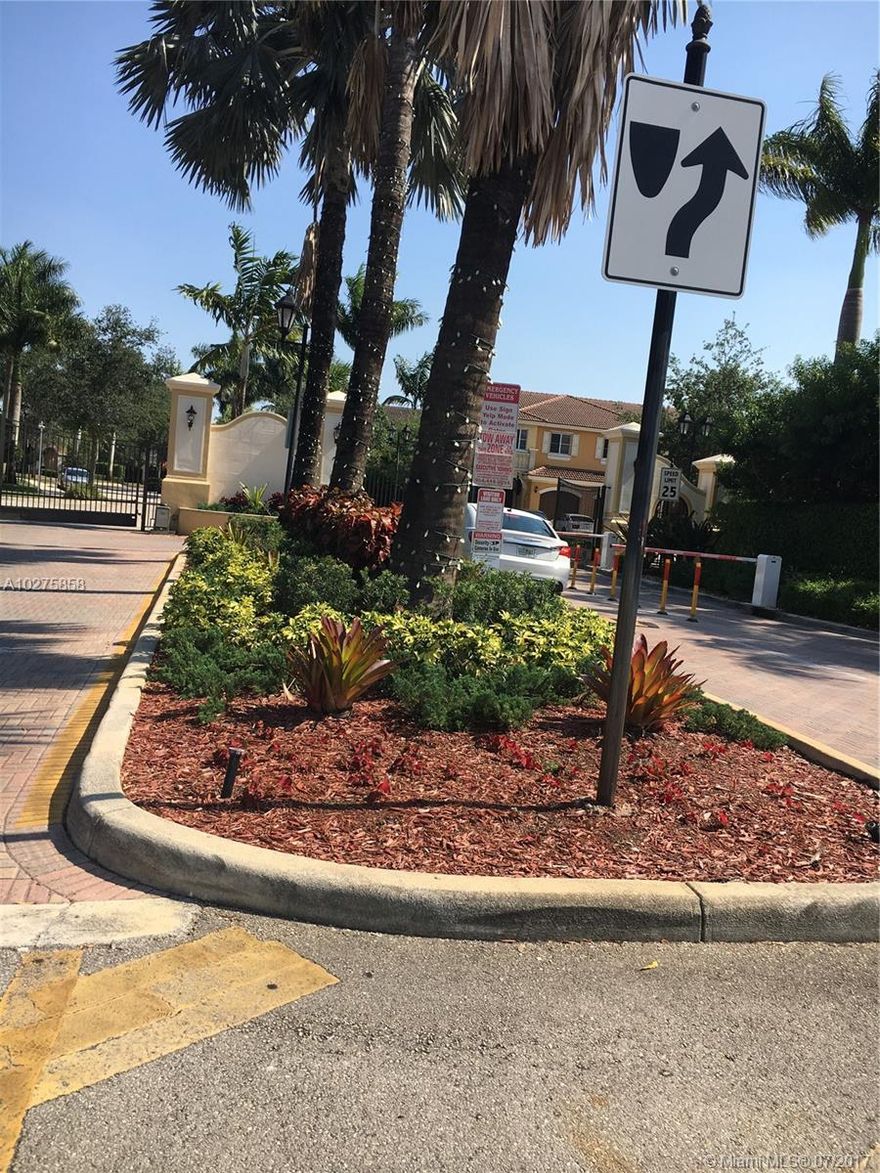 Very nice newer built town house.  This community is gated, quiet and very family oriented.  Near to schools, shopping and minutes away from Pembroke Lakes Mall.   Up graded kitchen and bathrooms, nice neutral tiles downstairs and lovely professionally installed wood floors throughout the upstairs.  Master bedroom is large and has trey ceiling. AC is one year old.