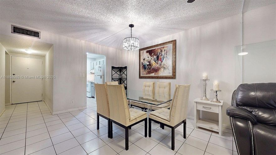 Charming 1-bedroom, 1.5-bath condominium located near downtown Coral Springs at 4153 NW 90th Ave APT 103, Coral Springs, FL 33065. This inviting 690 sq ft home is priced at $135,000 and offers a bright, open layout with tiled flooring, a glass dining table with cushioned chairs, and a cozy living area featuring a leather sofa. Highlights include a stunning chandelier, a glimpse of the modern kitchen. Enjoy the added benefits of a screen patio, storage room, clubhouse access, and a heated pool. Perfect for all ages, with a low $228/month HOA fee and low real estate taxes make it also great for investment. One year restriction to lease. Don’t miss out!