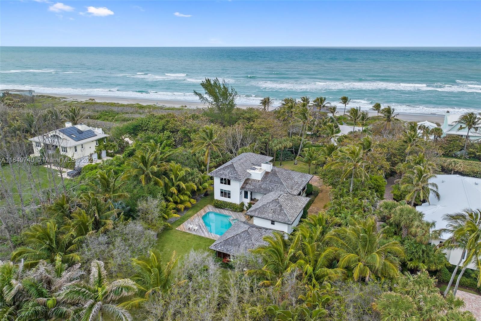 JUPITER ISLAND SPECIAL!! Beautiful and unique architects own home, sitting on a wonderful private lot at the North end of the island. Just steps to the gorgeous beach (about 200') without paying oceanfront prices.
Ocean views from primary bedroom, 2 story coral stone fireplace, Cypress ceilings, hardwood floors throughout.