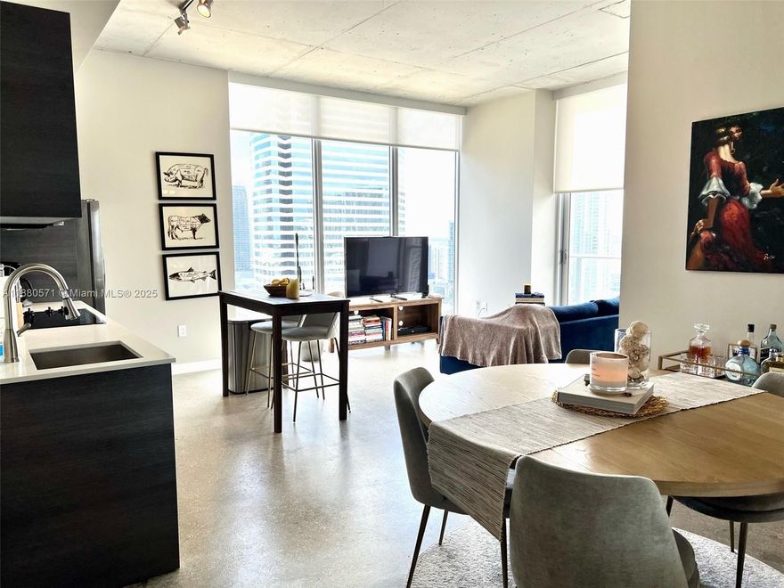 Beautiful 27th floor corner Condo located in the center of Downtown Miami. Great open floor plan, polished concrete floors, high ceilings, sleek kitchen with stainless steel appliances, in-unit full size W/D, floor to ceiling impact glass windows, lots of natural light, & balcony with stunning city views. Lux amenities include 2-story penthouse recreation area with pool table, media room, health club & spa, rooftop pool, gym, sauna/steam, residents lounge, 24/7 concierge, fob entry access, onsite pet walking area. Steps from restaurants, shops, Brickell, Bayside, and Metromover. 30 days rentals allowed & with high rental demands makes it an excellent investment opportunity. Note no parking space is included, however there is onsite valet svc or rental parking nearby.