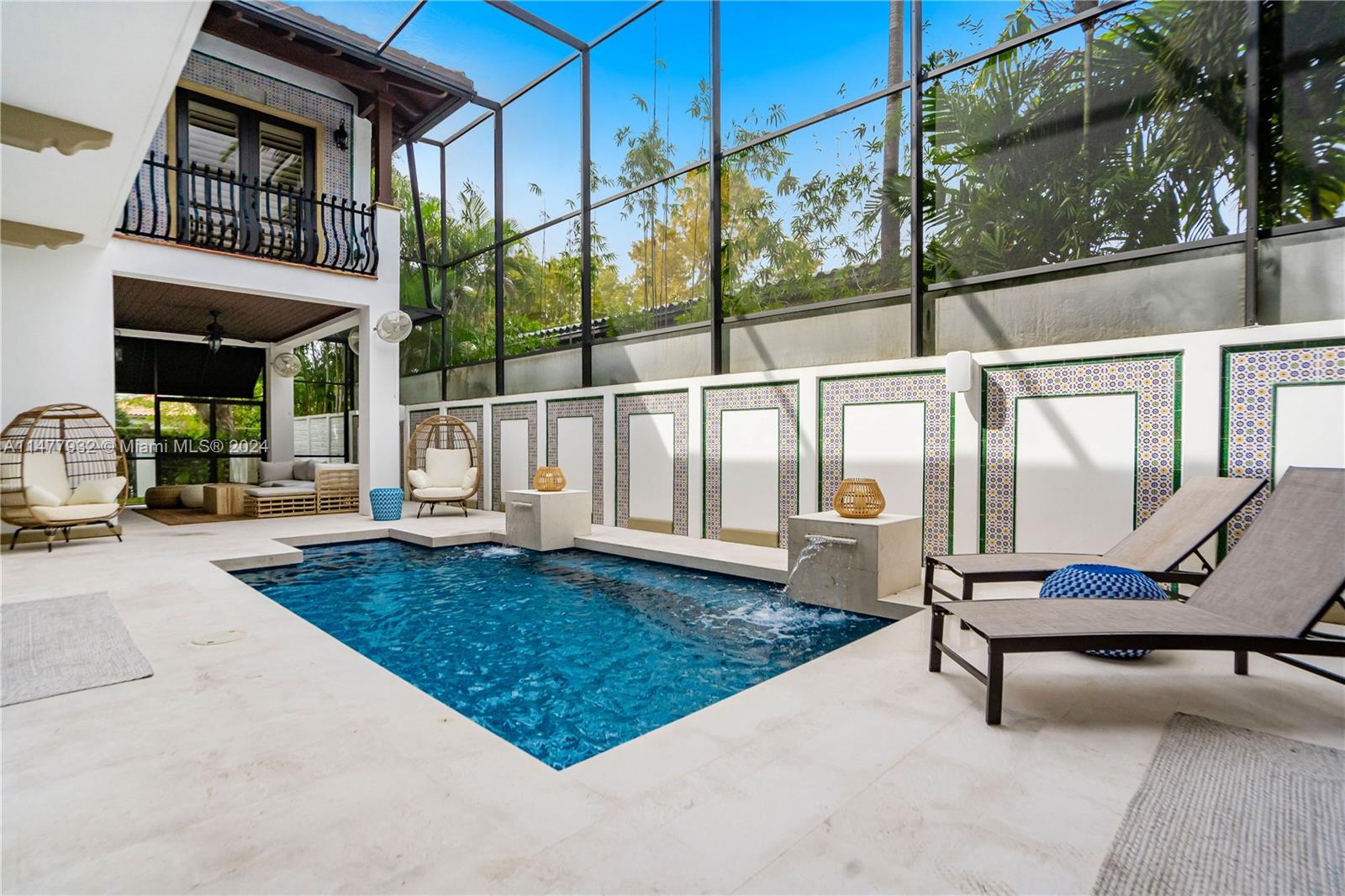 Welcome to this amazing retreat located in the heart of The Roads and Brickell Estates that comes with 4 Bedrooms /4 bathrooms and will take your breath away , 5,057 sqft of Living Space w/Movie Cinema ! With it's Mediterranean Spanish theme every detail is something to desire as you walk-in! A huge plus is the seamless flow this home offers between the interior/exterior space to the pool which is heated/salt water and relaxes you with the running fountains! This expansive floor plan comes with chefs kitchen , elevator to all 3 levels one of which is a 12 seat move cinema with bar, Arcade games , surround sound and flashy lights ! Ton of walk in closets in the bedrooms , Master comes with Jacuzzi tub and custom Marble steam shower !