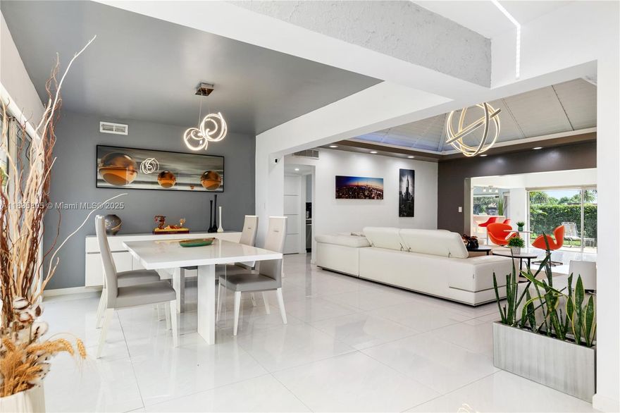 Welcome to this beautifully designed single-family home that effortlessly blends modern sophistication with everyday comfort. From the moment you walk through the French door into the oversize foyer you'll notice an updated open layout with vaulted ceilings. Completely updated all around with a huge living room you'll have plenty of room to entertain be it  there or the built in bar. 3 massive bedroom including the oversized primary bedroom. Newly done bathrooms each with dual vanity and lots of style.  3 skylights around the house for plenty of natural light. Brand new tile throughout. Roof and AC are new. Tankless water heater to save on money and never run out of hot water. Your backyard sits on what used to be a golf course so more space than you'll ever need.