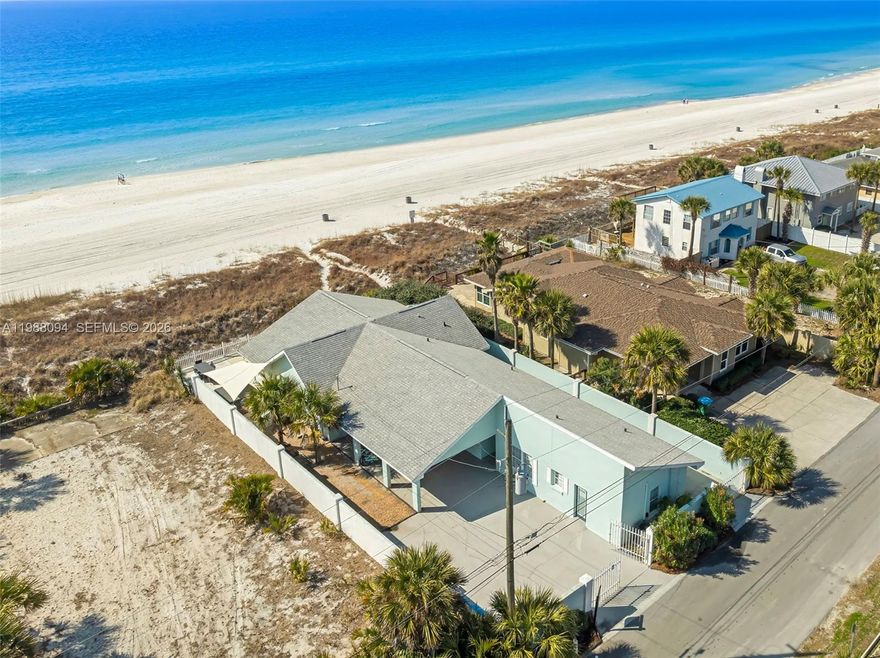 Incredible Gulf-front, 4BR/4BA + flex room beach home with proven rental income and a versatile multi-generational / split floorplan layout. This unique property offers the perfect setup for large families or investors, featuring a 2BR/2BA main house plus two private guest suites with full baths connected by breezeway, allowing privacy while keeping everyone together.

Enjoy breathtaking Gulf views from the sunroom and main living areas, with a spacious entertainment layout that includes a fully updated kitchen, outdoor BBQ area, jacuzzi, and large back porch with direct beach access — ideal for vacation living or short-term rental guests.

Recent updates include roof, HVAC systems, and remodeled primary bath, making this property move-in ready. Situated on a private drive with a 35-ft deep seawall for added protection, offering both security and peace of mind on the Gulf.

Property has 10 years of strong VRBO/Airbnb rental history, making it an excellent opportunity for investors seeking income-producing beachfront property or buyers looking for a turnkey second home.
Rare combination of privacy, income potential, flexible layout, and true Gulf-front living.