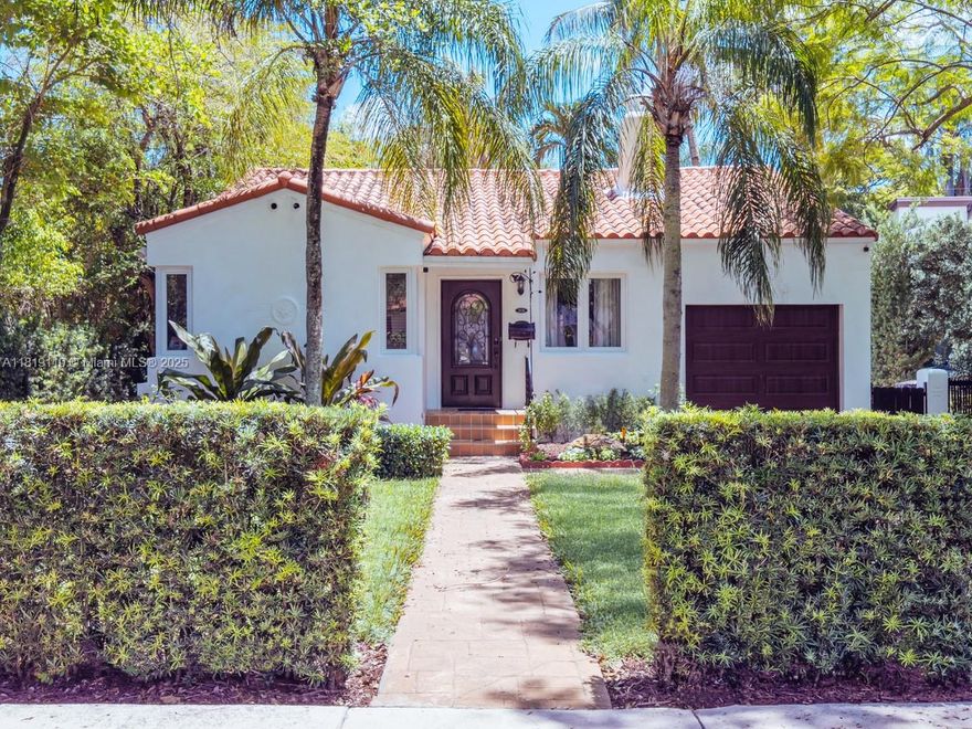 Rare and exquisite residence situated in the heart of Coral Gables, near the iconic DeSoto Fountain and Biltmore Hotel and Golf Course. As you enter, you are greeted by high cathedral ceilings, beautiful hardwood floors, and a wood-burning fireplace. Natural light streams into the Florida room, which overlooks the manicured backyard, complete with privacy hedges. Enjoy the warmth of this well-maintained home, which features two bedrooms with en-suite bathrooms and a walk-in closet adjacent to the primary bedroom. The spacious kitchen showcases custom cabinetry and opens into the dining room, providing ease of entertaining. The immaculate one-car garage is located just off the kitchen with washer, dryer and tankless water heater.