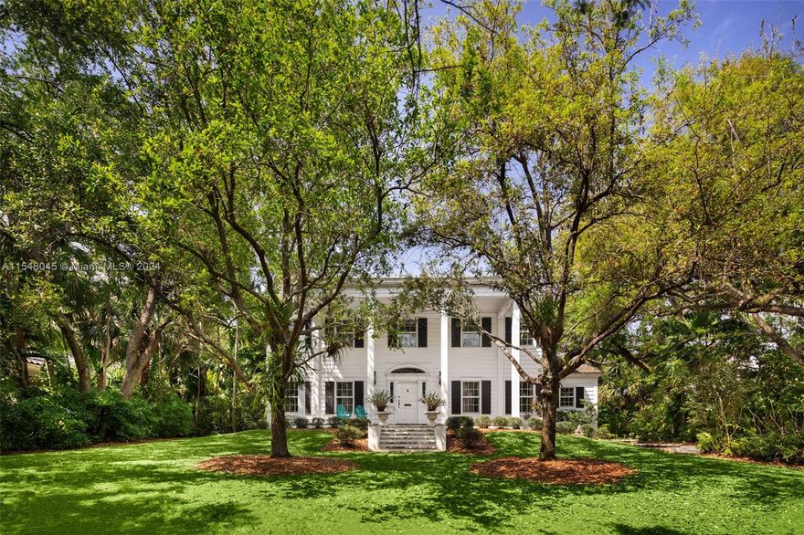 Magnificent, meticulously restored estate set high on a coastal coral rock ridge, just a short walk to Biscayne Bay. Enter the gate into a hidden, private drive that opens to the lush, tree-canopied grounds surrounding this exquisite home. The classic, double-height entry foyer welcomes you into light-filled living spaces including formal living, dining & family room that overlooks the magical garden. 1st level also offers a full guest suite, den/office & stunning kitchen w/ butler’s pantry and breakfast room. Main house has 4BR’s/3.5BA’s. Separate 1/1 guest house w/kitchen. Expansive & idyllic garden with brick terraces shaded by majestic oaks, completes this one-of-a-kind home. Close to the historic Grove village and just minutes to downtown, MIA, Key Biscayne & the Beaches.