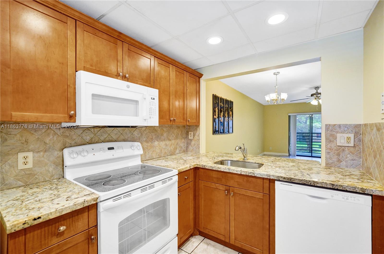 Welcome to 10332 Sunrise Lakes Blvd #206, a well-maintained condo located in the heart of Sunrise Lakes, a vibrant 55+ community known for its active lifestyle and convenient location. This charming unit offers comfortable living with a spacious & bright layout, serene water views, a well-appointed kitchen and a relaxing screened balcony perfect for morning coffee or evening sunsets. Enjoy access to resort-style amenities including multiple pools, clubhouse, fitness center, courtesy bus, billiard room, BBQ/picnic area, golf course, sauna, spa, tennis & more. Washer & dryer in unit! Located just minutes from shopping, dining and major highways, this home offers both tranquility and accessibility. Ideal for full-time residents or seasonal living. No pets, no rentals.