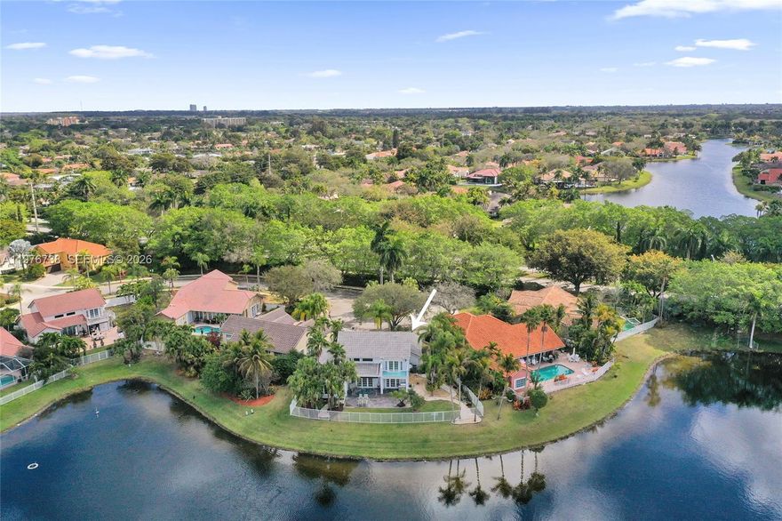 Tucked away on a private cul-de-sac, this exceptional point lot offers 135 feet of unobstructed panoramic lakefront, your own slice of paradise with breathtaking sunsets. Flooded with natural light, the beautifully reimagined interior features soaring ceilings and over $150,000 in upgrades, including a designer kitchen, bathrooms, lighting, flooring, doors, motorized blinds, roof and more. The primary suite features a private balcony with new impact doors and stunning water views. Enjoy a **wide fenced backyard with expansive lake views and plenty of space to entertain** Generous garage and oversized paver driveway. This home is Ideally situated in Laguna Springs, a gated enclave of just 142 homes, steps from Weston Town Center, houses of worship and A-rated schools.