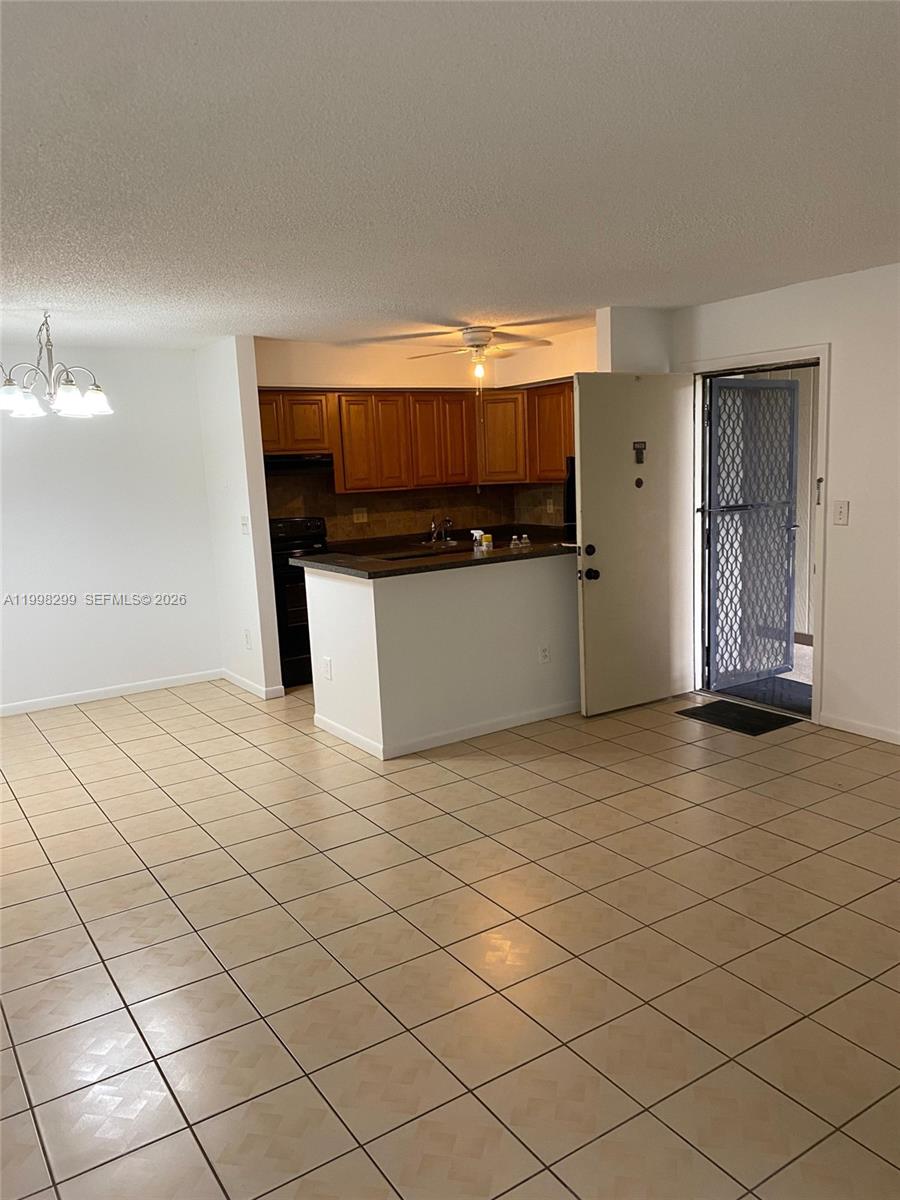 TAMARAC GARDENS CONDOMINI - Residential Lease